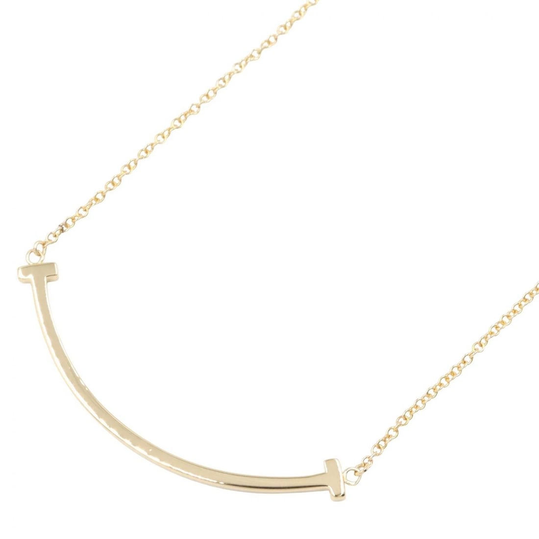 TIFFANY?CO T SMILE SMALL NECKLACE: TIFFANY?CO T Smile Small Necklace Brand: TIFFANY?CO Type/Style: Necklace Material: K18 (Yellow Gold), Color: Gold Size: Size Neck rotation?40.5/45.5cm(15.9") Motif W?37mm x H?4mm(1.5" x 0.2")