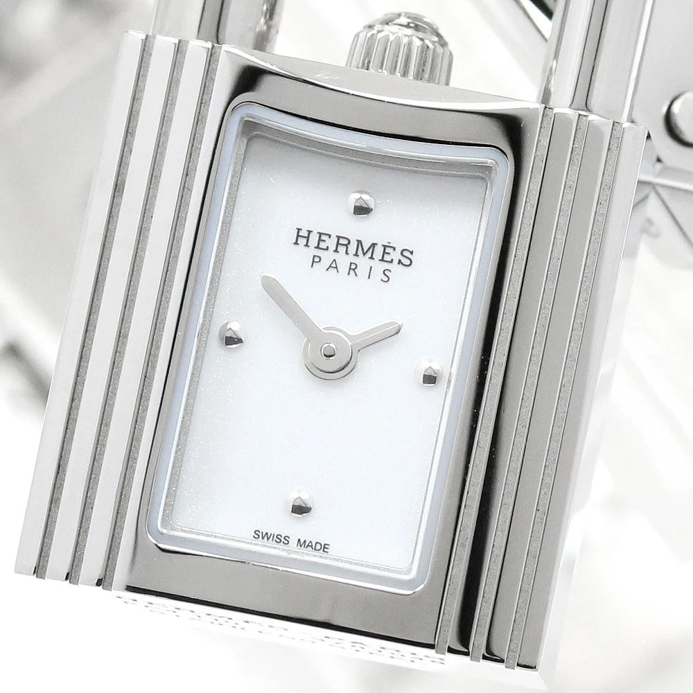 HERMES KELLY WATCH WHITE DIAL QUARTZ WATCH: HERMES Kelly watch white Dial Quartz Watch Brand: HERMES Type/Style: Wristwatch Material: Band Material Stainless Steel, Case Material Stainless Steel Color: Dial Color white Size: Case Size About16mm