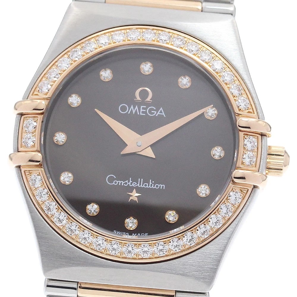 OMEGA CONSTELLATION DIAMOND BEZEL QUARTZ WATCH: OMEGA Constellation Diamond Bezel Quartz Watch Brand: OMEGA Type/Style: Wristwatch Material: Band Material Stainless Steel/PG, Case Material Stainless Steel/PG Color: Dial Color Brown Size: Case Size 