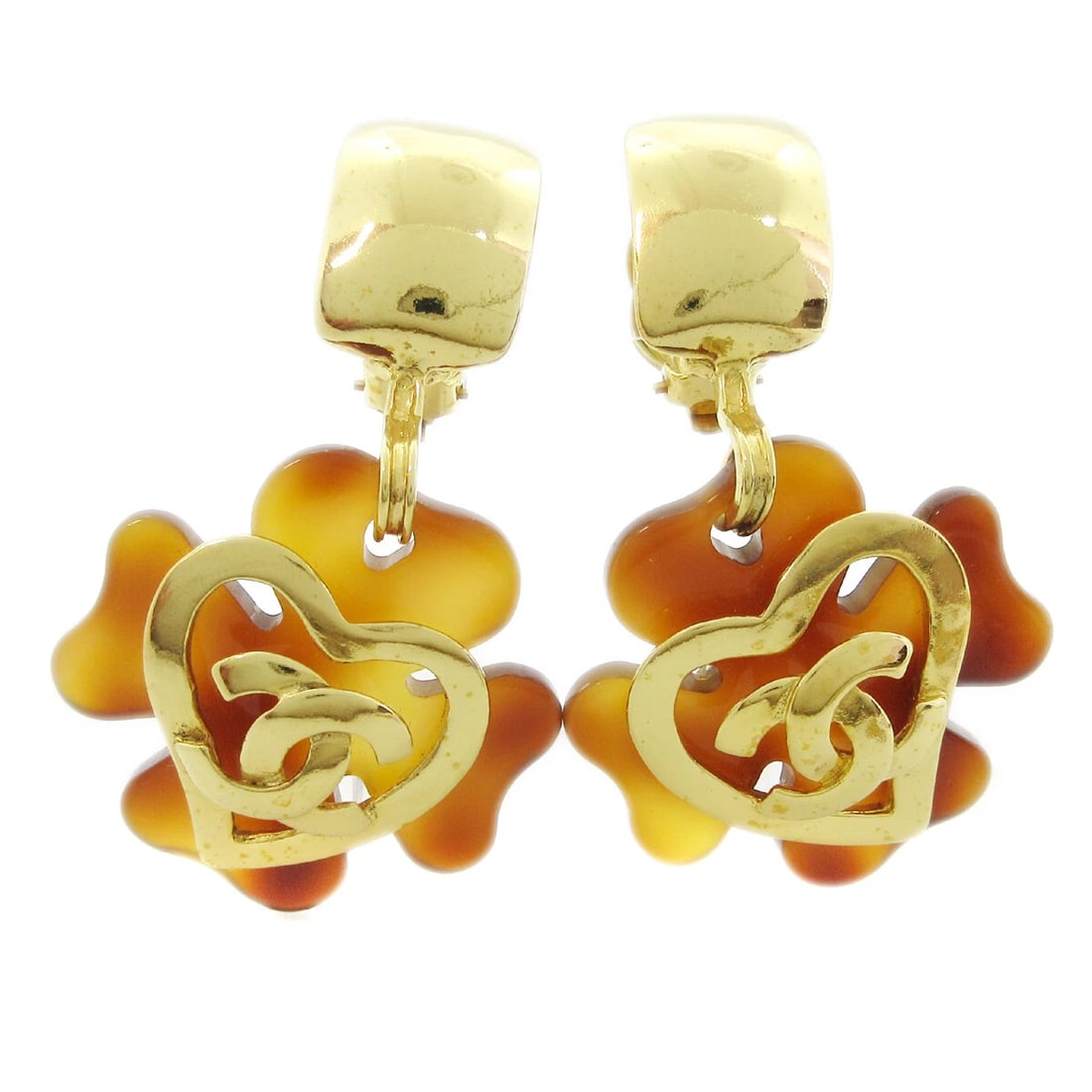 CHANEL CLOVER HEART DANGLE EARRINGS CLIP-ON ACRYLIC: Chanel Clover Heart Dangle Earrings Clip-On Acrylic Brand: Chanel Type/Style: Earrings Material: Acrylic Gold Plated Color: Gold, Brown Size: W 4.0 x H 6.9 cm Accessories: None Accessories Notice: