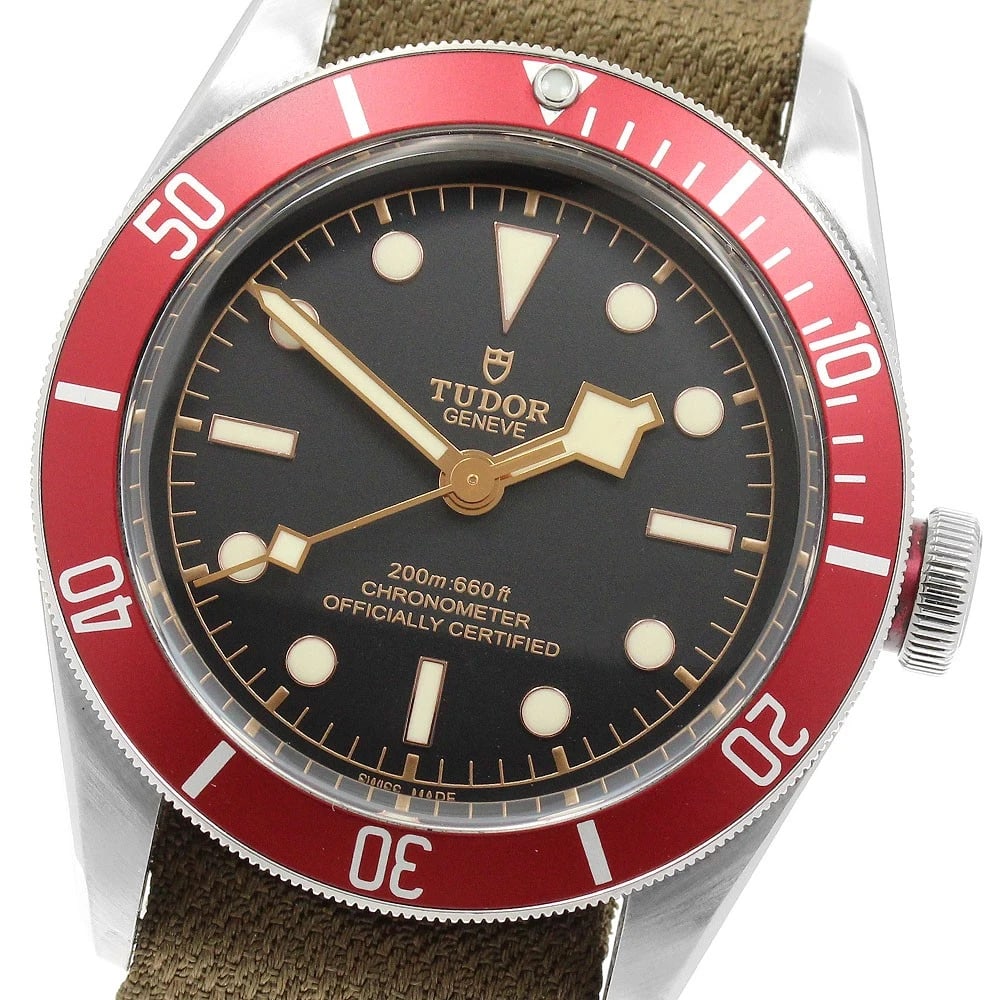 TUDOR HERITAGE BLACK BAY BLACK DIAL AUTOMATIC WATCH: TUDOR Heritage Black Bay Black Dial Automatic Watch Brand: TUDOR Type/Style: Wristwatch Material: Band Material Nylon, Case Material Stainless Steel Color: Band Color khaki, Case Color Silver / Red,