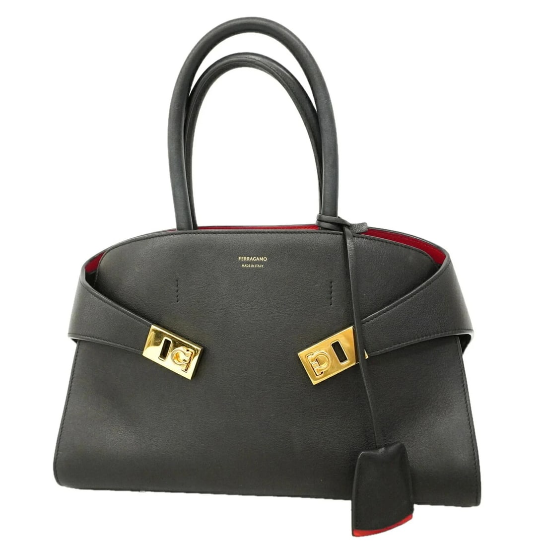 SALVATORE FERRAGAMO HUG LEATHER HANDBAG: Salvatore Ferragamo Hug Leather Handbag Brand: Salvatore Ferragamo Type/Style: Handbag Material: Leather Color: Black Size: (HxWxD) 23cm x 32cm x 14cm / 9.05inch x 12.59inch x 5.51inch Accessories: