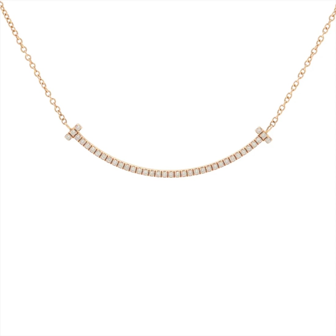 TIFFANY T SMILE SMALL DIAMOND NECKLACE 750(PG): Tiffany T Smile Small diamond Necklace 750(PG) Brand: Tiffany Type/Style: Necklace Material: 750(PG) Color: Pink Gold Size: Chain length:41.2cm Accessories: None Accessories Notice: When purchasing