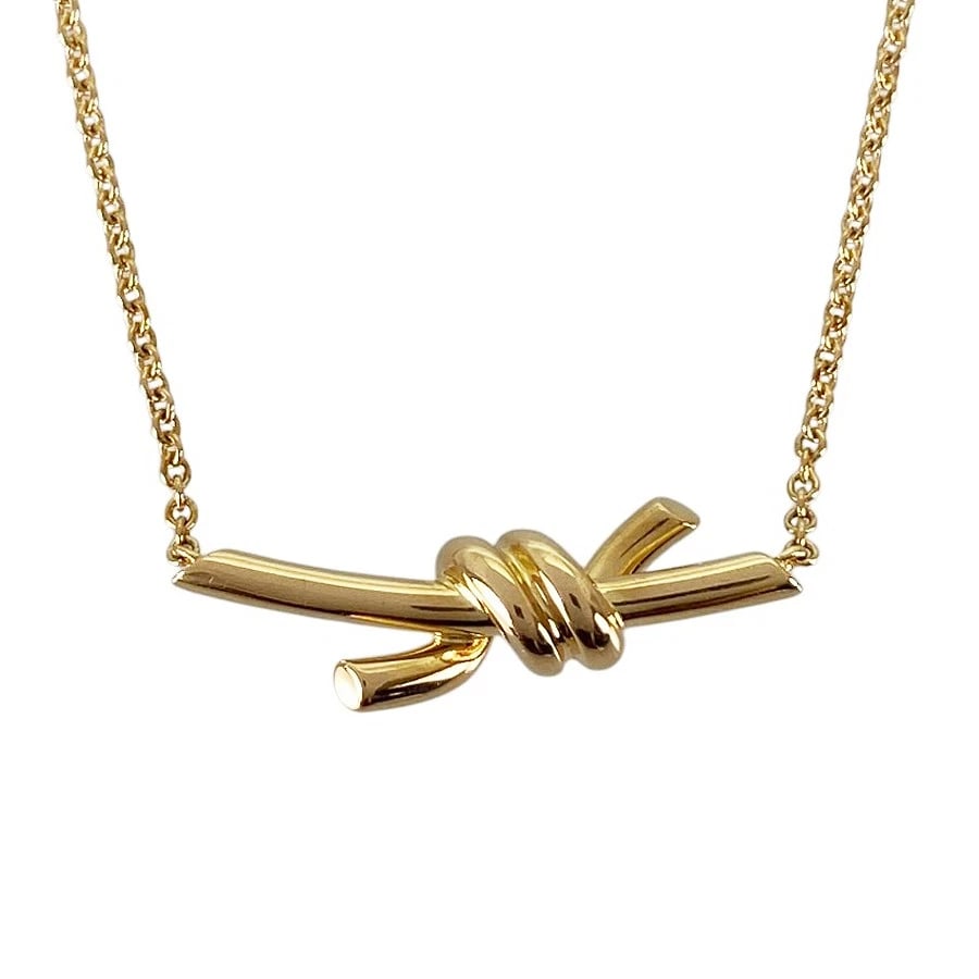 TIFFANY&CO. KNOT PENDANT YELLOW GOLD NECKLACE: TIFFANY&Co. Knot Pendant Yellow gold Necklace Brand: TIFFANY&Co. Type/Style: Necklace Material: 18K Yellow Gold Color: Gold Size: Top size:7.7mmx21.4mm Necklace full length:43cm Accessories: None