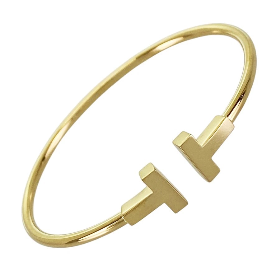 TIFFANY&CO. T WIRE S YELLOW GOLD BANGLE: TIFFANY&Co. T Wire S Yellow gold Bangle Brand: TIFFANY&Co. Type/Style: Bangle Material: 18K Yellow Gold Color: Gold Size: Wrist Size:15cm Accessories: None Accessories Notice: When purchas