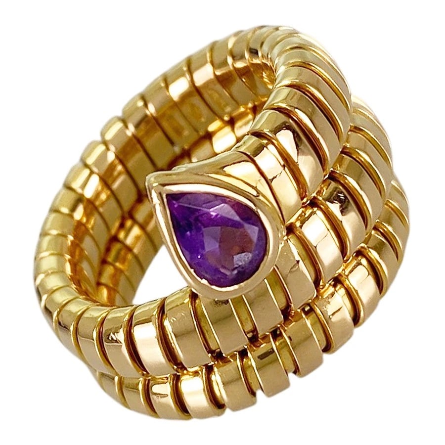 BVLGARI TUBOGAS YELLOW GOLD AMETHYST RING: BVLGARI Tubogas Yellow gold Amethyst Ring Brand: BVLGARI Type/Style: Ring Material: 18K Yellow Gold Main Stone Amethyst Color: Gold Size: US 6.5 Accessories: None Accessories Notice: When purchasing