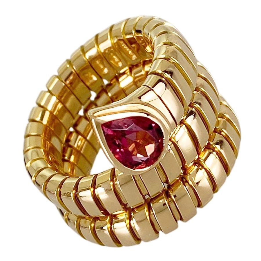BVLGARI TUBOGAS YELLOW GOLD PINK TOURMALINE RING: BVLGARI Tubogas Yellow gold Pink Tourmaline Ring Brand: BVLGARI Type/Style: Ring Material: 18K Yellow Gold Main Stone Tourmaline Color: Gold Size: US 5 Accessories: None Accessories Notice: When