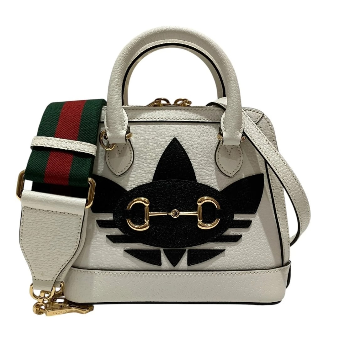 GUCCI X ADIDAS COLLABORATION MINI TOP HANDLE BAG HANDBAG: Gucci x Adidas Collaboration Mini Top Handle Bag Handbag Brand: Gucci Type/Style: Handbag Material: Leather , Canvas Color: White Size: (HxWxD) 18.5cm x 20cm x 7.5cm / 7.28inch x 7.87inch x 2.95inch