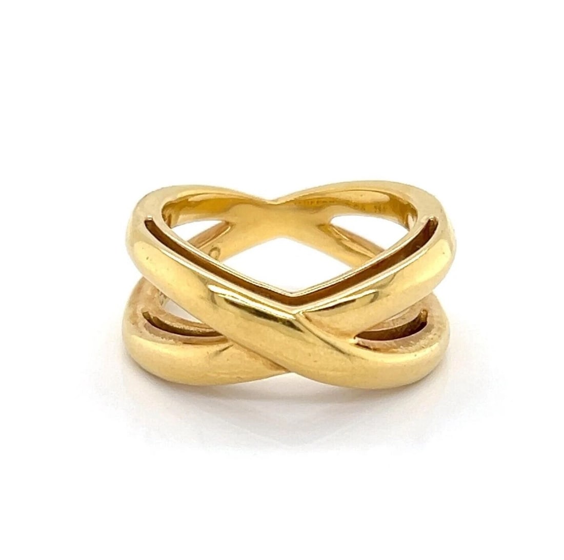 TIFFANY & CO. DOUBLE X CROSSOVER BAND RING: Tiffany & Co. Double X Crossover Band Ring Brand: Tiffany & Co. Type/Style: Ring Material: 18k yellow gold Color: Gold Size: 5 US Accessories: None Accessories Notice: When purchasing pre-owned