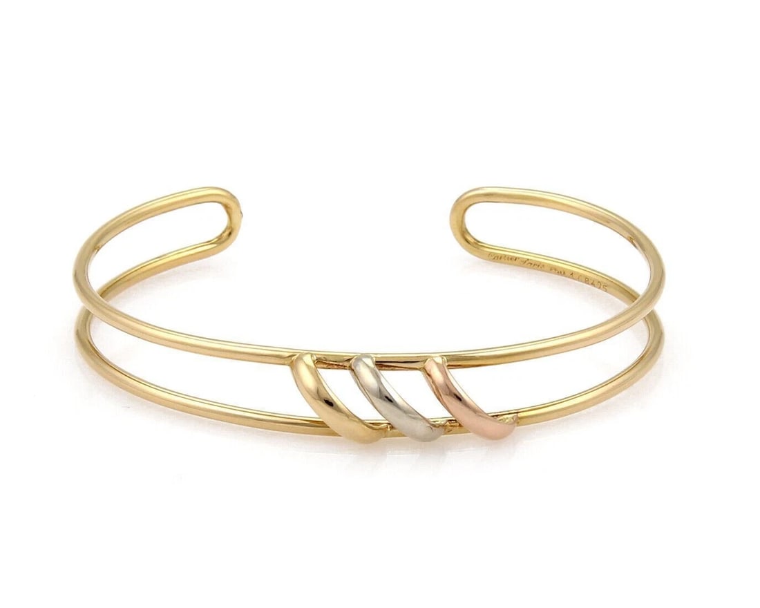 CARTIER TRINITY 18K TRI-COLOR GOLD WIRE CUFF BRACELET: Cartier Trinity 18k Tri-Color Gold Wire Cuff Bracelet Brand: Cartier Type/Style: Bracelet Material: 18k yellow rose and white gold Color: yellow, rose, and white Size: Measurements: Approximately