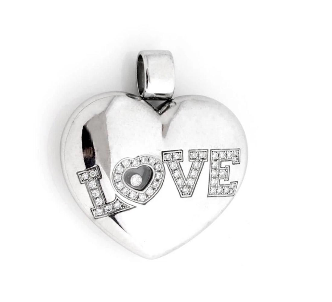 CHOPARD HAPPY DIAMONDS LOVE 18K WHITE GOLD ENDANT: Chopard Happy Diamonds LOVE 18k White Gold endant Brand: Chopard Type/Style: Pendant Material: 18k white gold Main Stone Natural Color: white Size: Measurements: Approximately 1.58inch long with bail