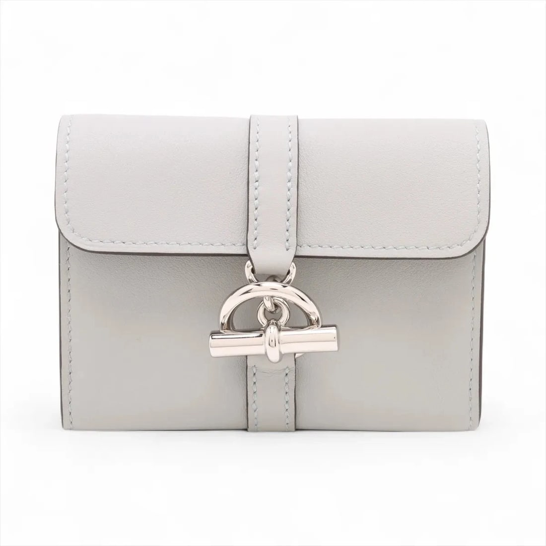 HERMES GLENAN VEAU SWIFT COIN PURSE BLEU BRUME SILVER: Hermes Glenan Veau Swift Coin Purse Bleu Brume Silver Brand: Hermes Type/Style: Coin Purse Material: Veau Swift Color: Bleu Brume Size: Height:3.0inchLength:4.1inchDepth:1.0inch Accessories: None