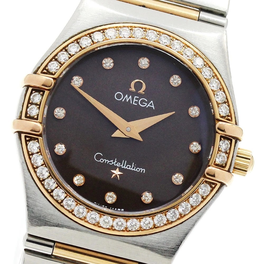 OMEGA CONSTELLATION DIAMOND BEZEL DIAMOND QUARTZ WATCH: OMEGA Constellation Diamond Bezel Diamond Quartz Watch Brand: OMEGA Type/Style: Wristwatch Material: Band Material Stainless Steel/PG, Case Material Stainless Steel/PG Color: Band Color Silver / Pink