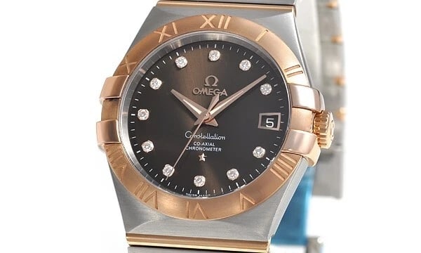 OMEGA CONSTELLATION CO-AXIAL CHRONOMETER WATCH: Omega Constellation Co-Axial Chronometer Watch Brand: OMEGA Type/Style: Wristwatch Material: Case Material Material (Main) Stainless Steel, Pink Gold Color: Chocolate Size: Case Size 35.0mm