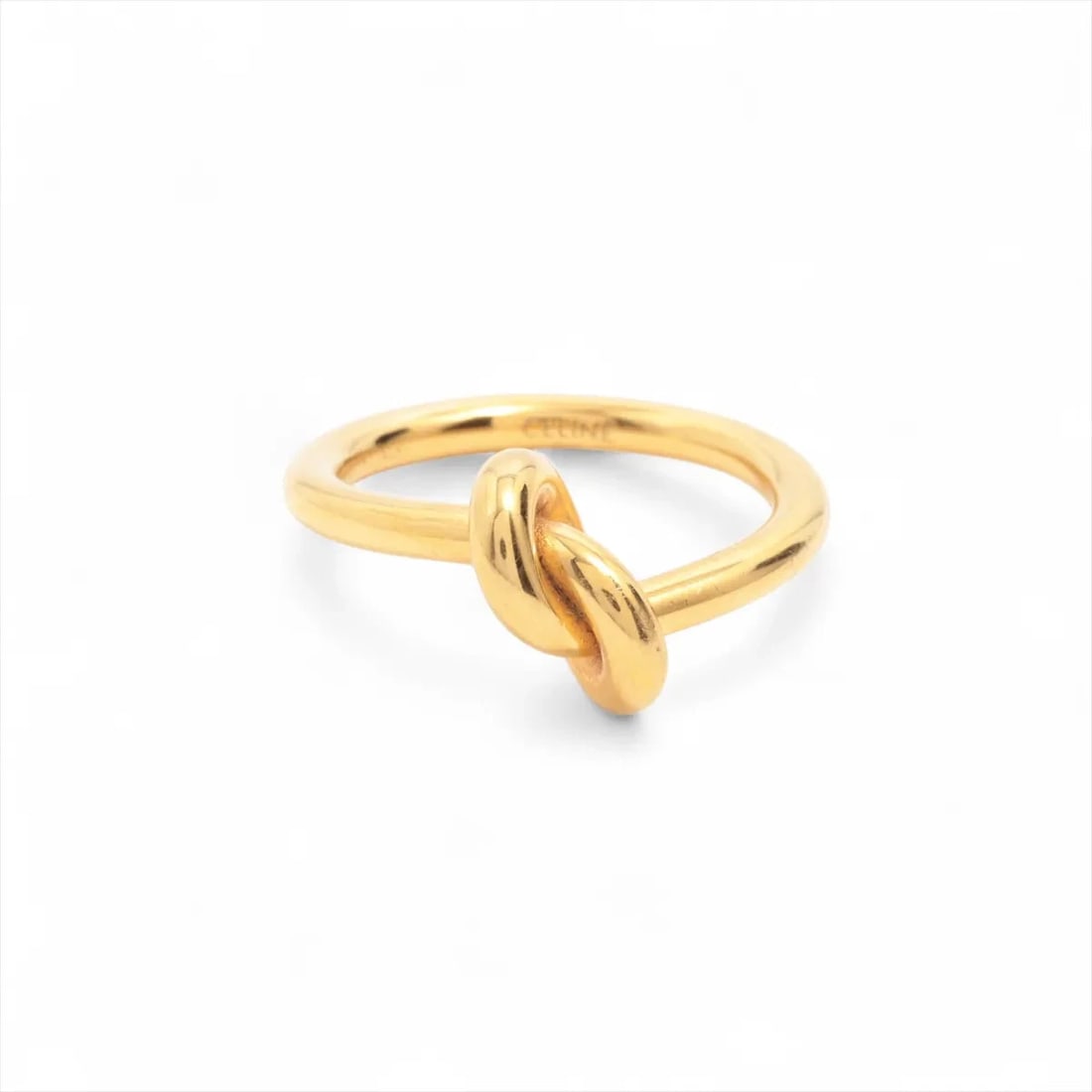 CELINE KNOT RING FREE GOLD BRASS NICKEL: Celine Knot Ring free gold brass nickel Brand: Celine Type/Style: Ring Material: brass nickel Color: Gold Size: 4.5 - 4.75 US Accessories: None Accessories Notice: When purchasing pre-owned goods,