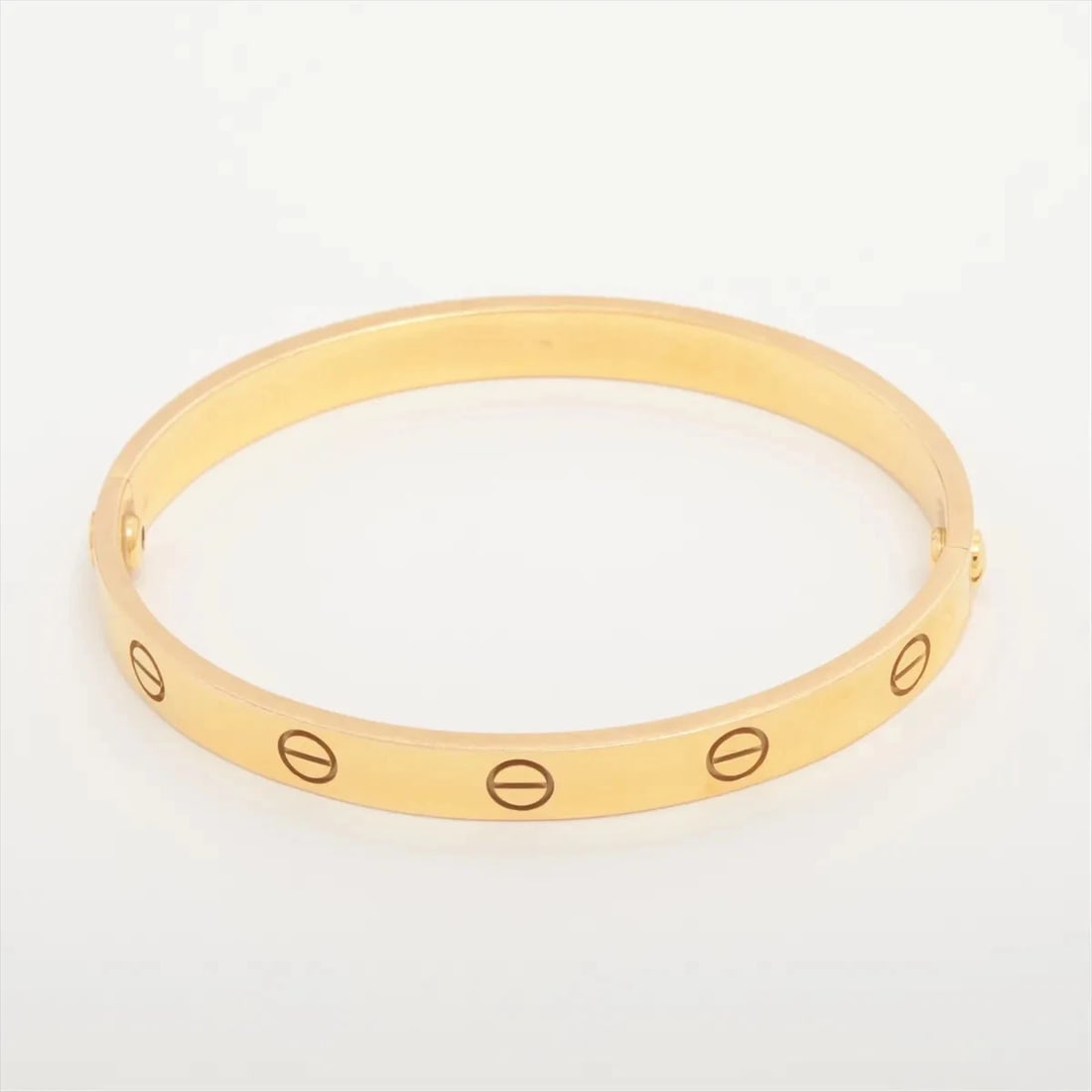 CARTIER LOVE BRACELET 750(YG): Cartier Love Bracelet 750(YG) Brand: Cartier Type/Style: Bracelet Material: 750(YG) Color: Yellow Gold Size: Bracelet length:15.8cm Accessories: None Accessories Notice: When purchasing pre-owned