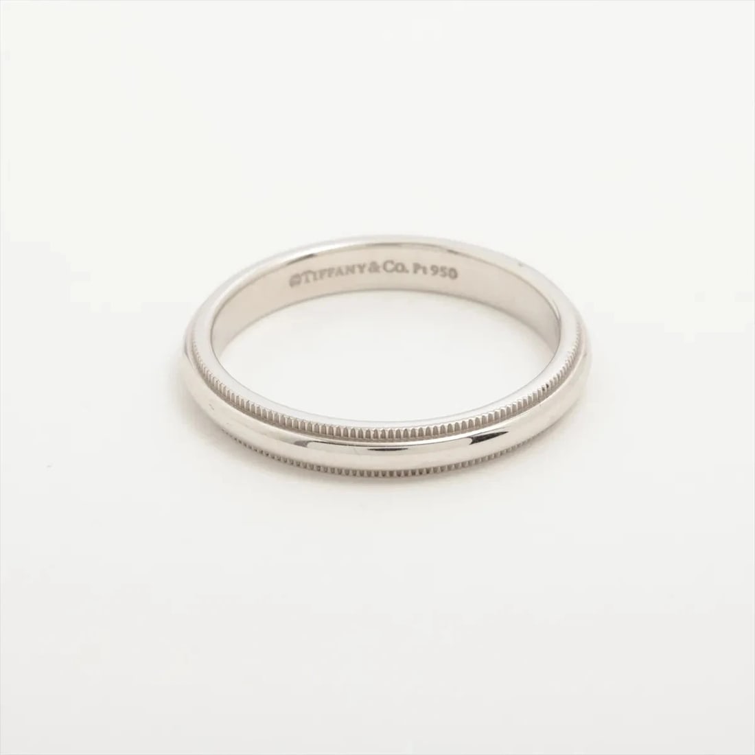 TIFFANY MILGRAIN BAND RING PT950: Tiffany Milgrain Band Ring Pt950 Brand: Tiffany Type/Style: Ring Material: Pt950 Color: Silver Size: 8.5 - 8.75 US Accessories: None Accessories Notice: When purchasing pre-owned goods, pl