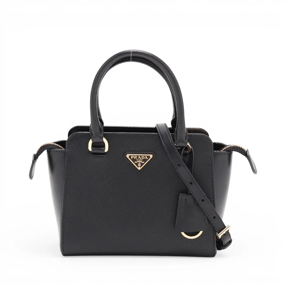 PRADA SAFFIANO LEATHER 2 WAY HANDBAG BLACK: Prada Saffiano Leather 2 Way Handbag Black Brand: Prada Type/Style: Top Handle Bag Material: Leather Color: Black Size: Height:5.9inchLength:7.1inchDepth:3.5inch Accessories: None Accessor