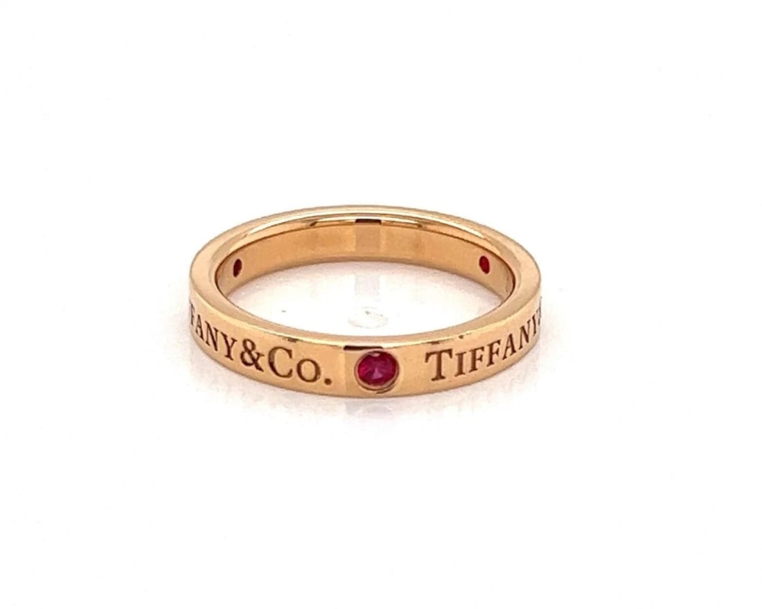 TIFFANY & CO. RUBY 18K ROSE GOLD FLAT BAND RING: Tiffany & Co. Ruby 18k Rose Gold Flat Band Ring Brand: Tiffany & Co. Type/Style: Ring Material: 18k rose gold Main Stone Ruby Color: Pink Size: 4.5 US Accessories: None Accessories Notice: