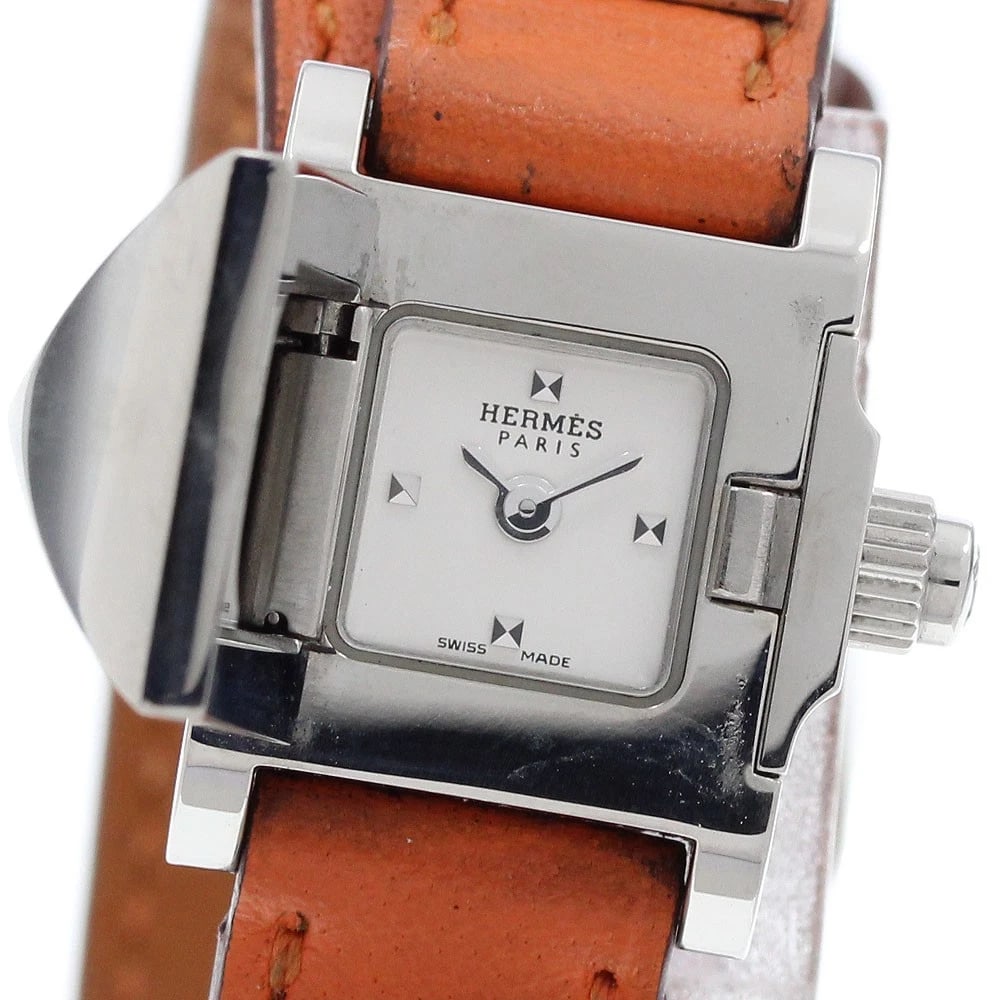 HERMES MINIMEDORE DOUBLE TOUR SILVER DIAL QUARTZ WATCH: HERMES Minimedore Double Tour Silver Dial Quartz Watch Brand: HERMES Type/Style: Wristwatch Material: Band Material leather, Case Material Stainless Steel Color: Band Color Orange, Case Color Silver,