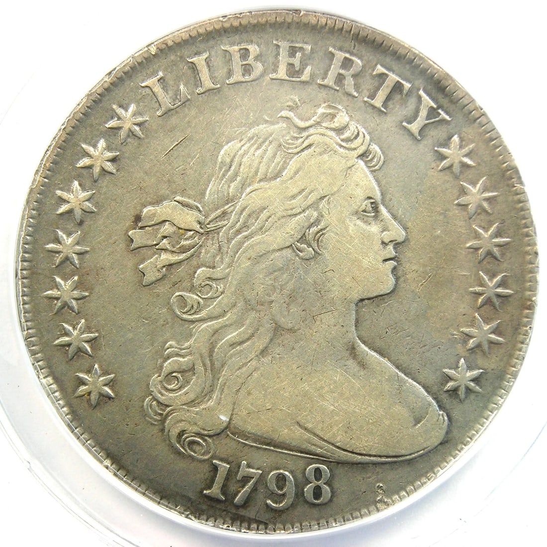 1798 DRAPED BUST SILVER DOLLAR $1 COIN: 1798 Draped Bust Silver Dollar $1 Coin Year: 1798 Denomination: $1 Composition: Silver Country of Origin: United States Accessories: None Accessories Notice: When purchasing pre-owned good