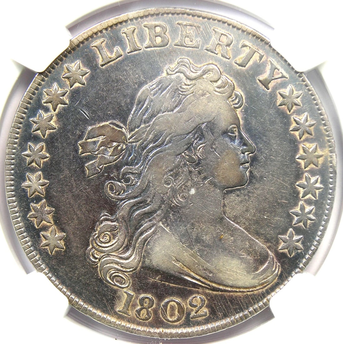 1802 DRAPED BUST SILVER DOLLAR $1 COIN: 1802 Draped Bust Silver Dollar $1 Coin Year: 1802 Denomination: $1 Composition: Silver Country of Origin: United States Accessories: None Accessories Notice: When purchasing pre-owned good