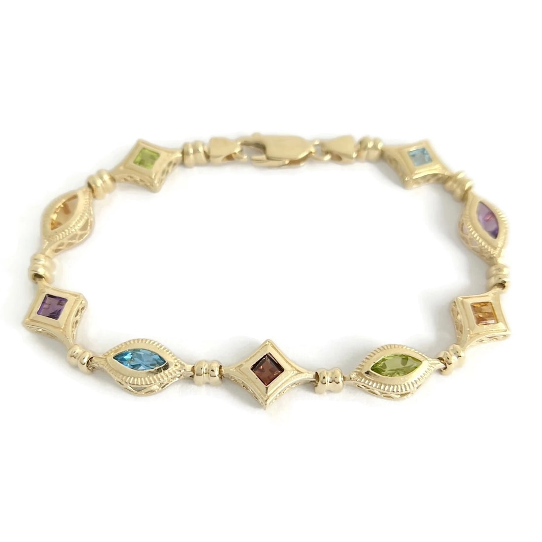 MULTICOLORED GEMSTONE CHAIN LINK TENNIS BRACELET: Multicolored Gemstone Chain Link Tennis Bracelet Brand: Unbranded Type/Style: Bracelet Material: 14K yellow gold, Color: Gold Size: Length: 7 inches Width: 9.3 mm Accessories: None Accessories