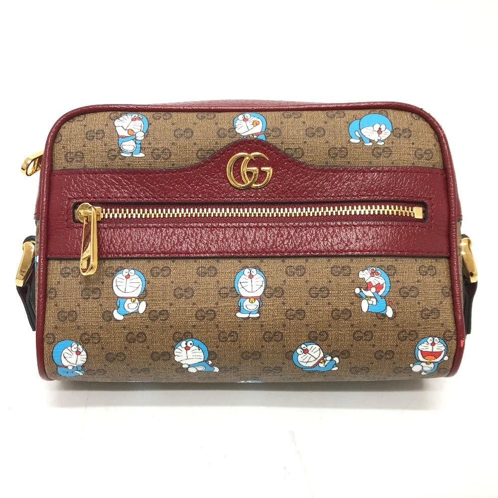 GUCCI GG SUPREME DORAEMON X GUCCI BAG SHOULDER BAG: GUCCI GG Supreme Doraemon x GUCCI Bag Shoulder Bag Brand: GUCCI Type/Style: Shoulder Bag Material: GG Supreme Canvas Color: BrownxGoldHardware Size: W7.1xH5.1xD2.4inch / W18cmxH13cmxD6cm Accessori