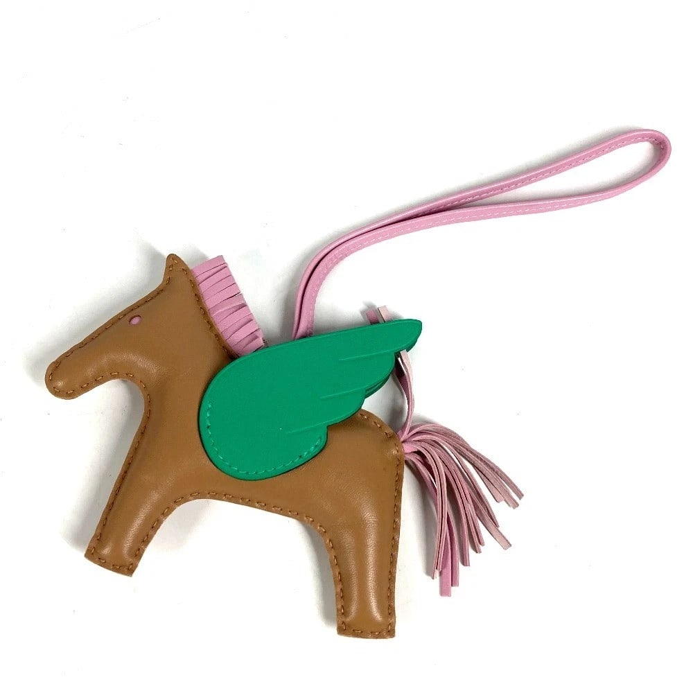 HERMES HORSE KEY HOLDER CHEVAL RODEO PEGASUS: HERMES Horse Key Holder Cheval Rodeo Pegasus Brand: HERMES Type/Style: charm Material: Anyo Miro Color: GreenxBeige x Pink Size: Total Length: 9.8inch / 25cm Accessories: None Accessories
