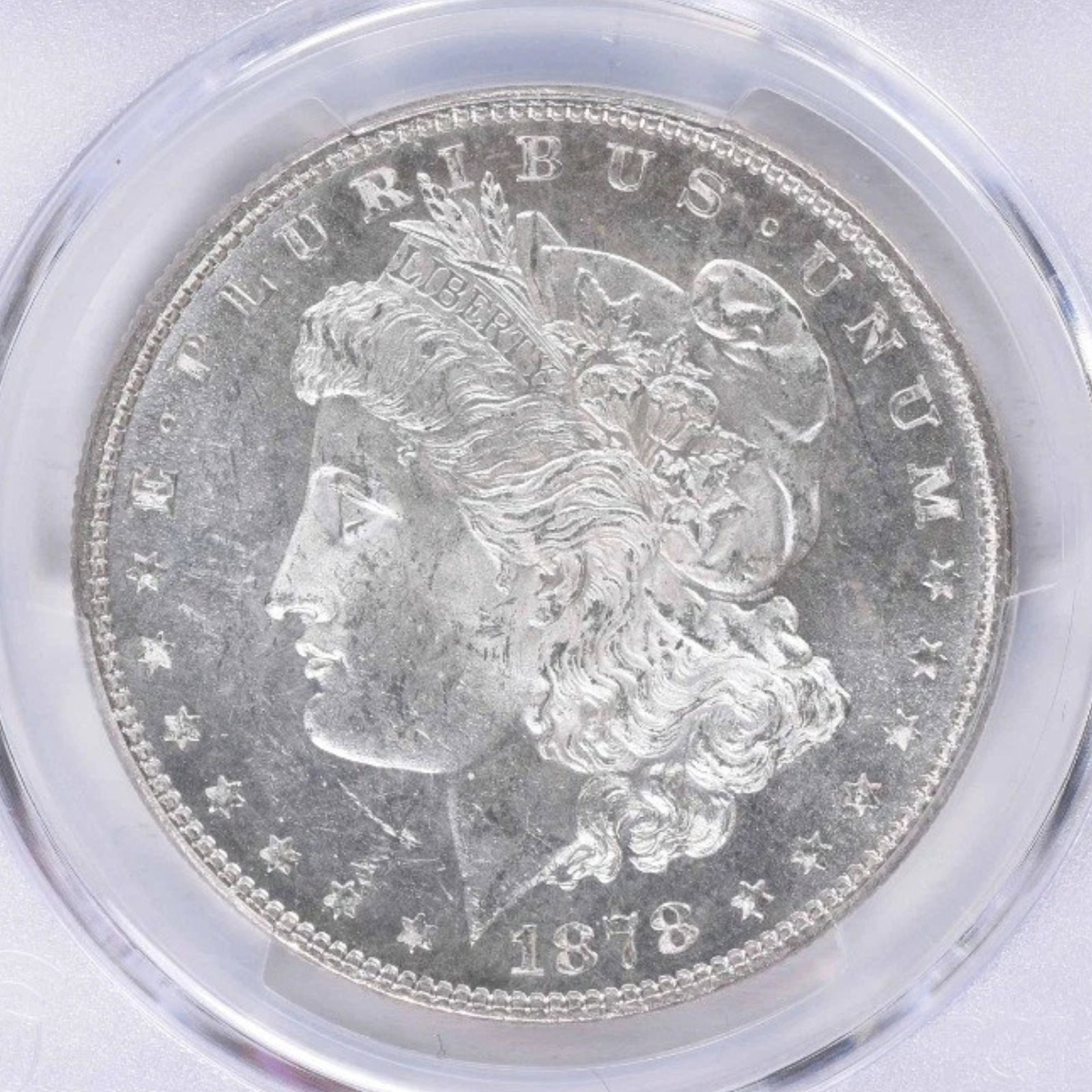 1878 MORGAN SILVER DOLLAR 7TF REVERSE: 1878 Morgan Silver Dollar 7TF Reverse Year: 1878 Composition: 90% Silver, 10% Copper Denomination: $1 Country of Origin: United States Accessories: None Accessories Notice: When purchasing pre-owned