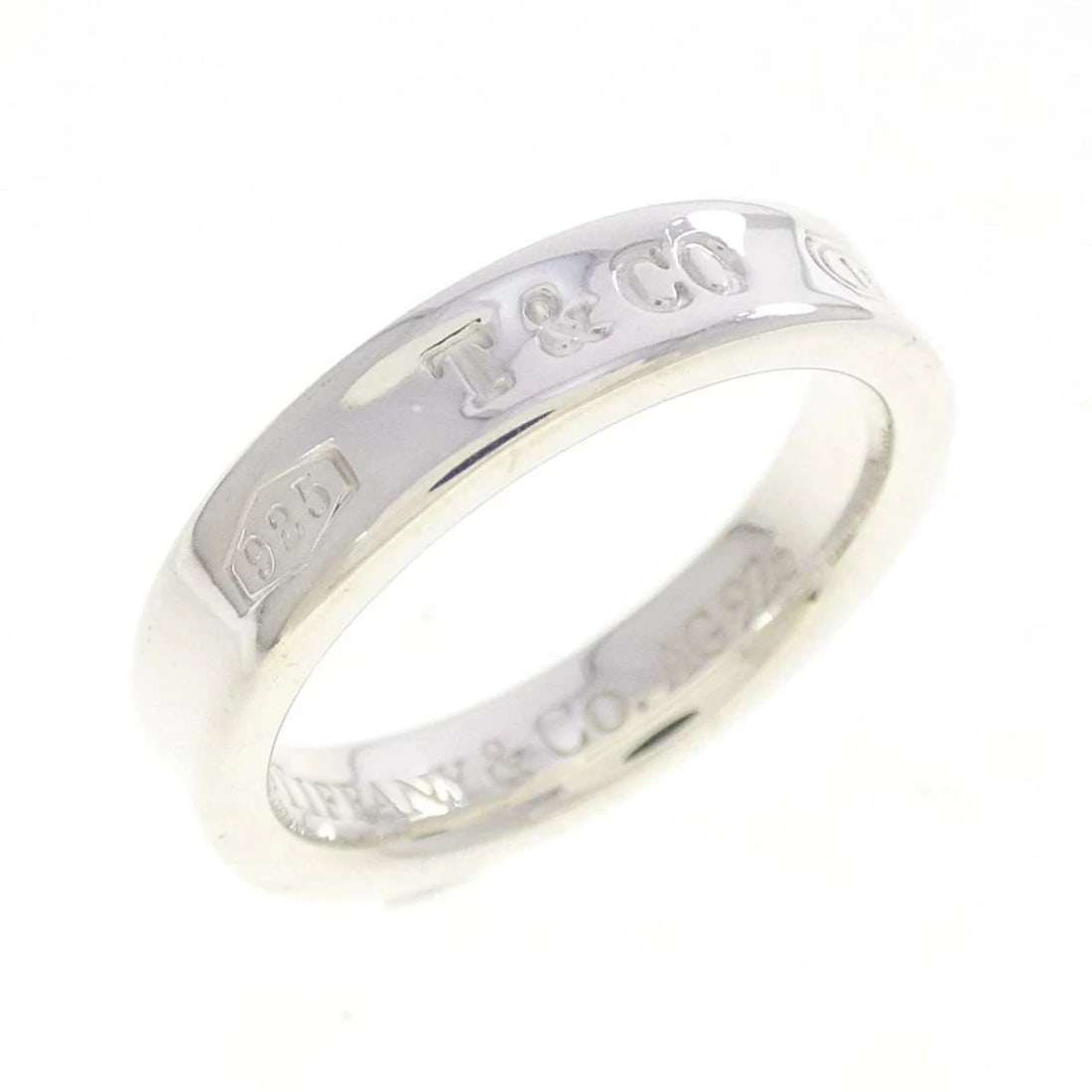 TIFFANY & CO. NARROW SILVER RING: Tiffany & Co. Narrow Silver Ring Brand: Tiffany & Co. Type/Style: Ring Material: 925 Sterling Silver, Color: Silver Size: US 5 Accessories: None Accessories Notice: When purchasing pre-own