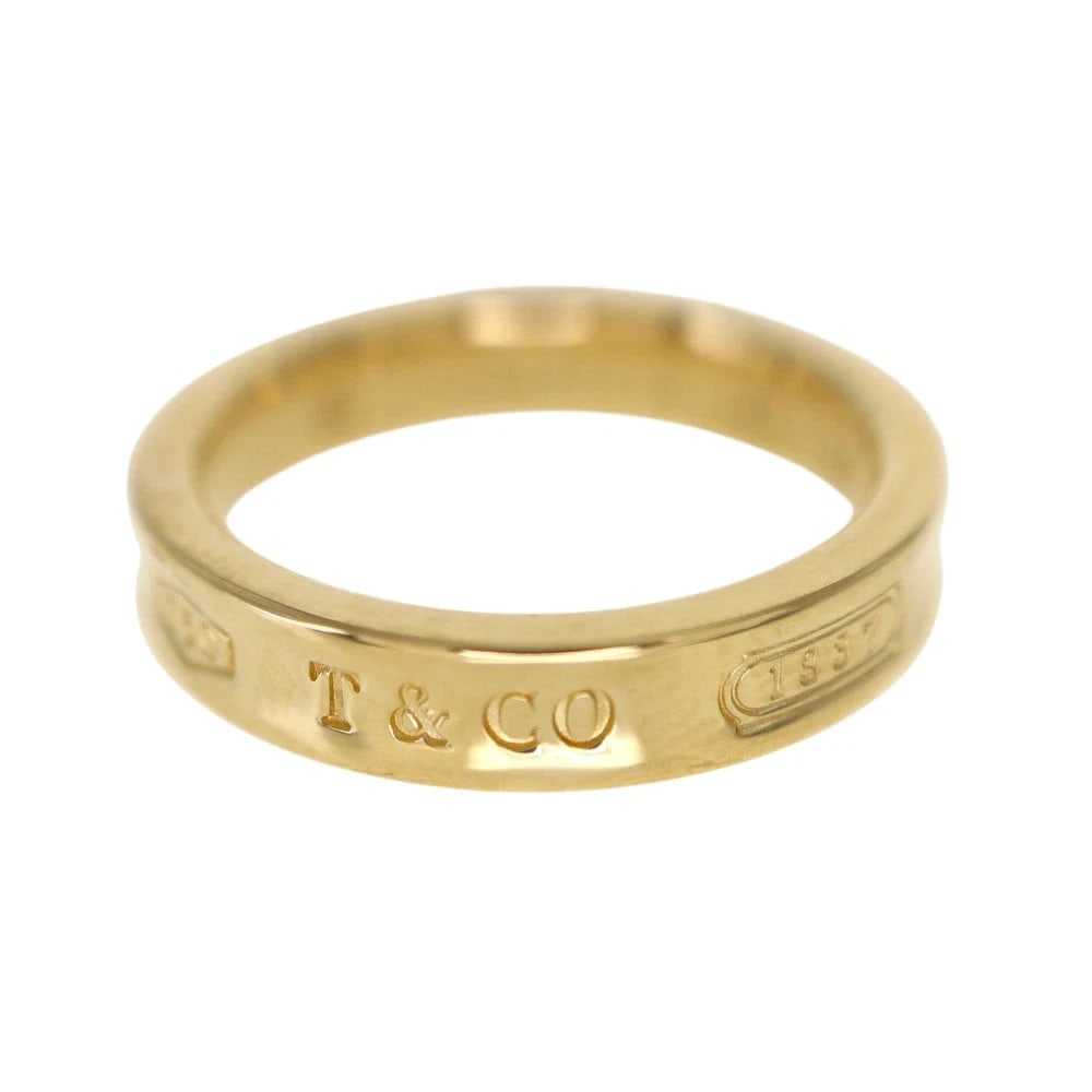 TIFFANY & CO. NARROW ROLL RING YELLOW GOLD: Tiffany & Co. Narrow Roll Ring Yellow Gold Brand: Tiffany & Co. Type/Style: Ring Material: K18 Yellow Gold, Color: Gold Size: US 5.5 Accessories: None Accessories Notice: When purchasing p