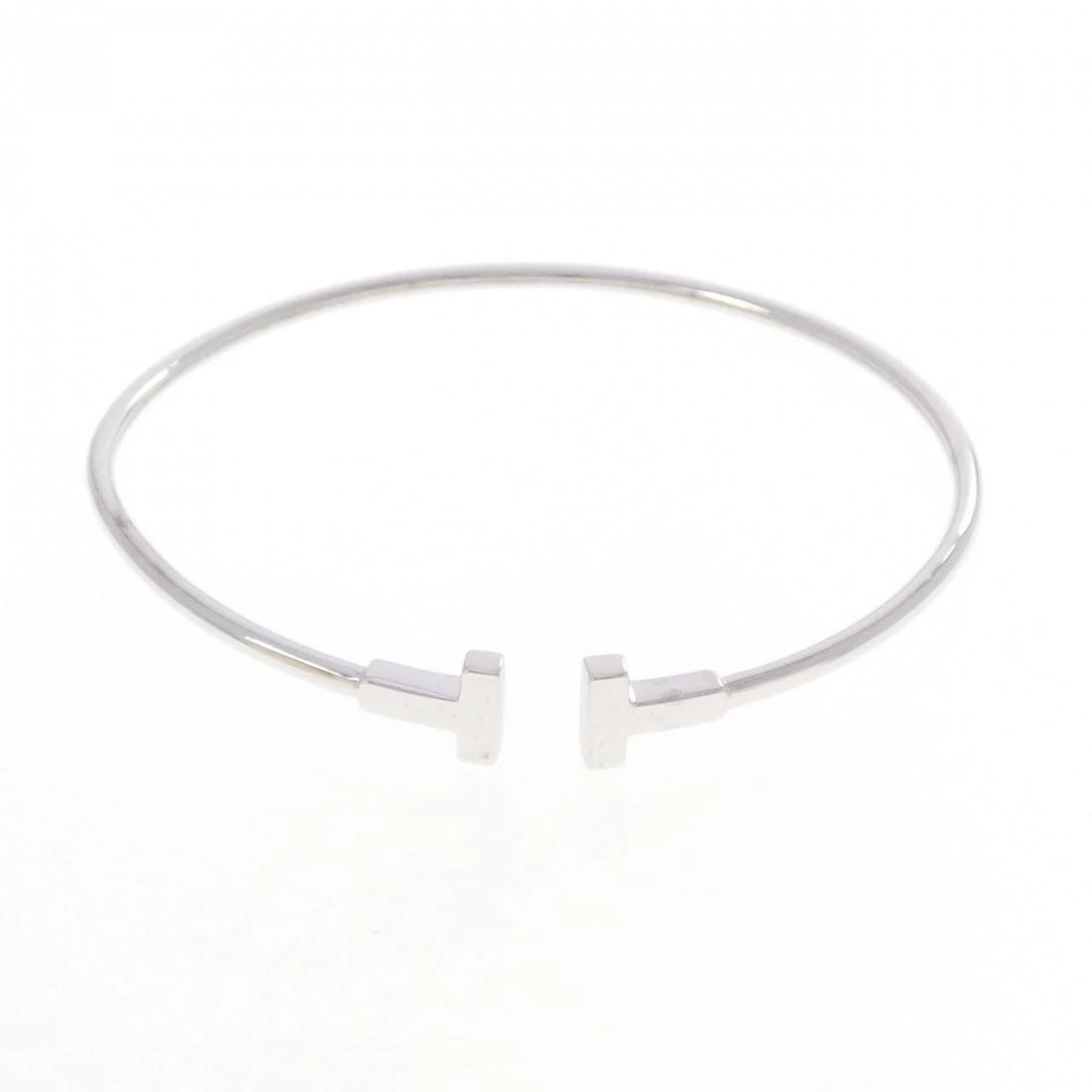 TIFFANY & CO. T NARROW WIRE BANGLE: TIFFANY & Co. T Narrow Wire Bangle Brand: TIFFANY&Co. Type/Style: TIFFANY & Co. Bracelet Material: 750 white gold, Color: White Gold Size: 16.5cmActual Size Max width approx: 6.8mm Accessories: None