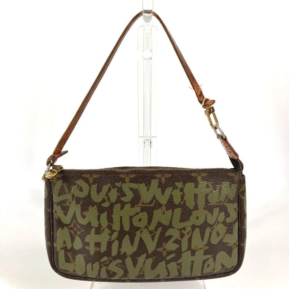 LOUIS VUITTON MONOGRAMGRAFFITI POCHETTE: LOUIS VUITTON MonogramGraffiti Pochette Brand: Louis Vuitton Type/Style: Shoulder Bag Material: MonogramGraffitiCanvas Color: khakixBrown Size: W7.9xH4.9xD1.2inch / W20cmxH12.5cmxD3cm Accessories:
