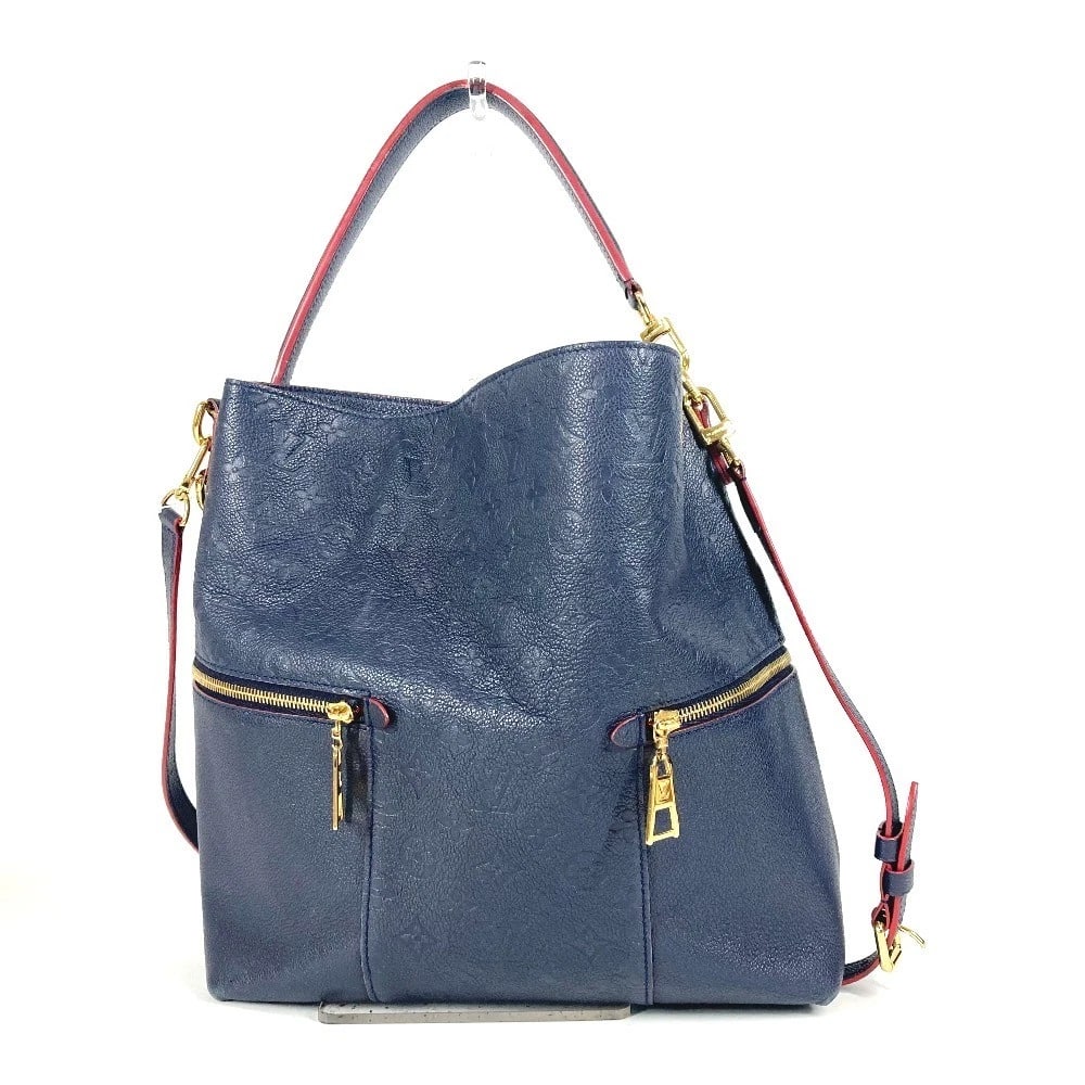 LOUIS VUITTON MONOGRAMEMPREINTE MERRY SHOULDER BAG: LOUIS VUITTON MonogramEmpreinte Merry Shoulder Bag Brand: LOUIS VUITTON Type/Style: Shoulder Bag Material: MonogramEmpreinteLeather Color: Marine Rouge / Navy Size: W11.8xH12.4xD4.9inch / W30cmxH31.5c