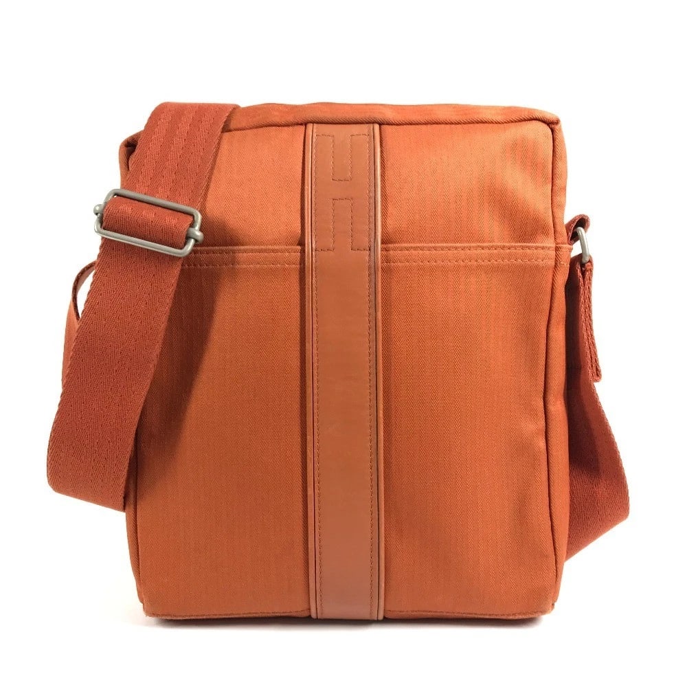 HERMES ACAPULCO BAG CROSSBODY POCHETTE SHOULDER BAG: HERMES Acapulco Bag Crossbody Pochette Shoulder Bag Brand: HERMES Type/Style: Shoulder Bag Material: Canvas Color: Orange Size: W8.7xH10.2xD2.2inch / W22cmxH26cmxD5.5cm Accessories: None A