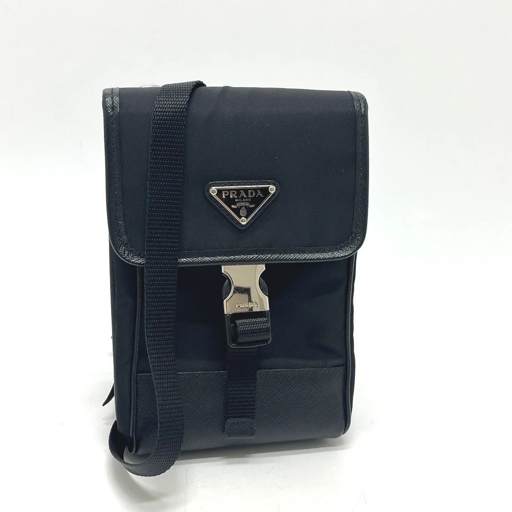 PRADA SMARTPHONE CASE POCHETTE BAG SHOULDER BAG: PRADA Smartphone case Pochette bag Shoulder Bag Brand: PRADA Type/Style: Shoulder Bag Material: Nylon / Leather Color: Black Size: W4.3xH7.1xD1.2inch / W11cmxH18cmxD3cm Accessories: None A