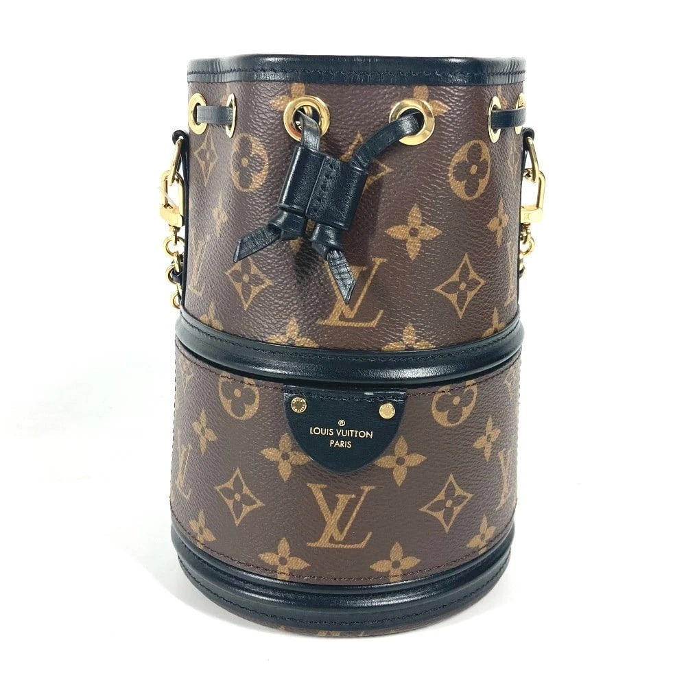 LOUIS VUITTON MONOGRAM KANOE HAND BAG: LOUIS VUITTON Monogram Kanoe Hand Bag Brand: LOUIS VUITTON Type/Style: Shoulder Bag Material: MonogramCanvas Color: BrownxBlack Size: W5.5xH8.1xD5.5inch / W14cmxH20.5cmxD14cm Accessories: None