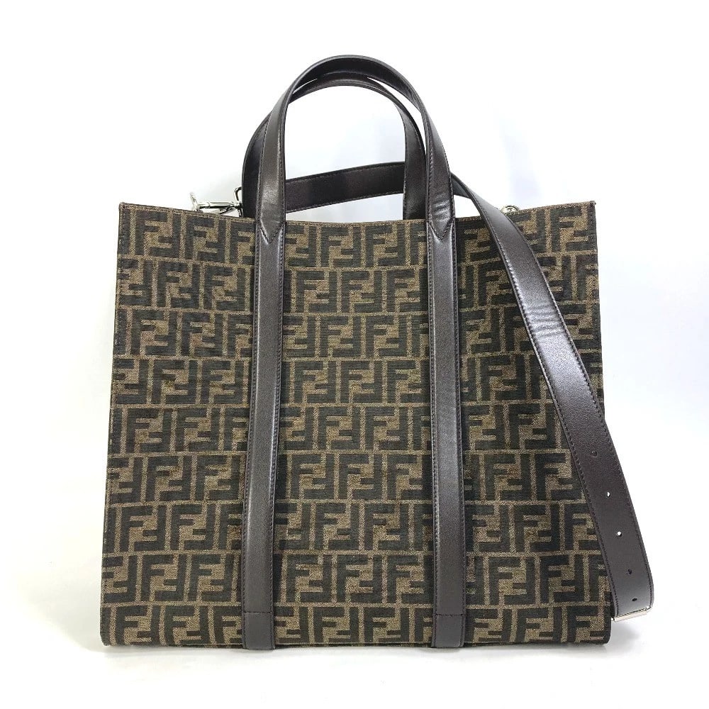 FENDI CROSSBODY ZUCCA SHOPPING BAG 2WAY SHOULDER BAG: FENDI Crossbody Zucca Shopping bag 2WAY Shoulder Bag Brand: FENDI Type/Style: Tote Bag Material: Canvas/Leather Color: BrownxBlack Size: W15.4xH13.6xD7.3inch / W39cmxH34.5cmxD18.5cm Accessories: N