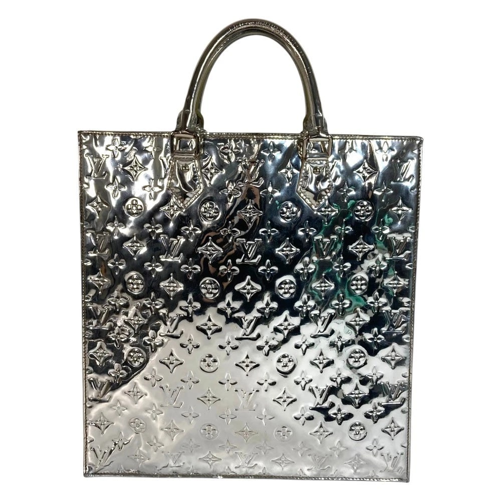 LOUIS VUITTON MONOGRAMMIROIR SAC PLAT TOTE BAG: LOUIS VUITTON MonogramMiroir Sac Plat Tote Bag Brand: LOUIS VUITTON Type/Style: Hand Bag Material: Leather Color: Argent / Silver Size: W14.2xH14.8xD3.0inch / W36cmxH37.5cmxD7.5cm Accessories: None