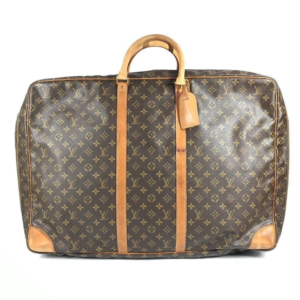 LOUIS VUITTON MONOGRAM SIRIUS 65 HAND BAG: LOUIS VUITTON Monogram Sirius 65 Hand Bag Brand: Louis Vuitton Type/Style: Duffle Bag Material: MonogramCanvas Color: Brown Size: W25.0xH16.5xD7.1inch / W63.5cmxH42cmxD18cm Accessories: None