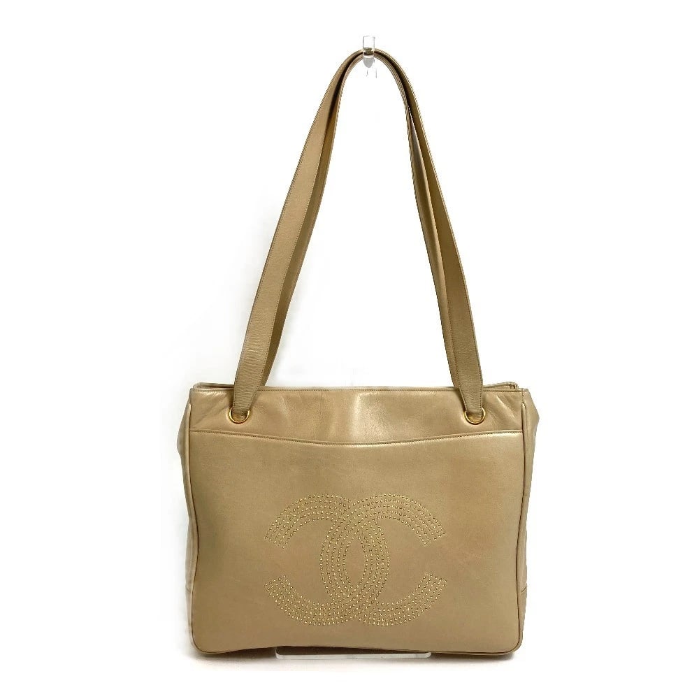 CHANEL STUDS SHOULDER BAG SHOULDER BAG TOTE BAG LAMBSKIN: CHANEL Studs Shoulder Bag Shoulder Bag Tote Bag Lambskin Brand: CHANEL Type/Style: Tote Bag Material: Lambskin Leather Color: BeigexGoldHardware Size: W12.2xH9.8xD2.6inch / W31cmxH25cmxD6.5cm Acce
