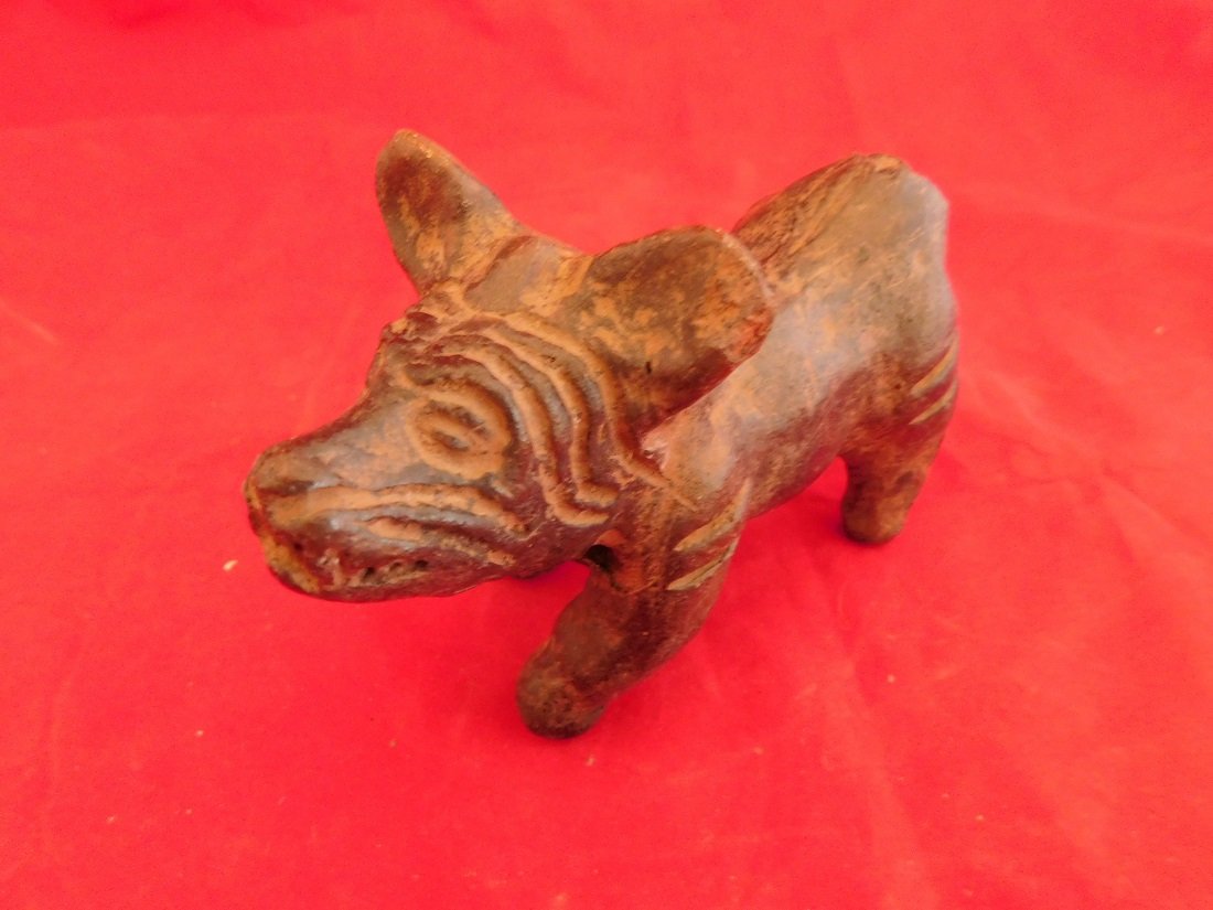 Pre-Columbian dog Baby rattle: This is a baby rattle in the shape of a dog. very cool piece since the Mayans held these Animals as sacred and spiritual beings.