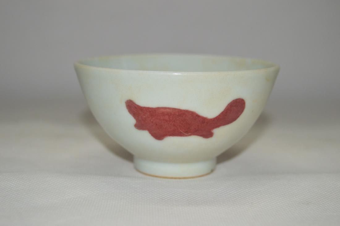 AN UNDERGLAZED RED CUP WITH A FISH DESIGN (1 of 5)