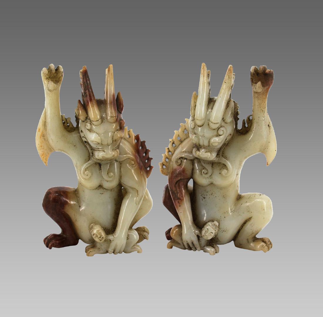A PAIR OF HETIAN WHITE JADE TOMB GUARDIAN BEAST FIGURE