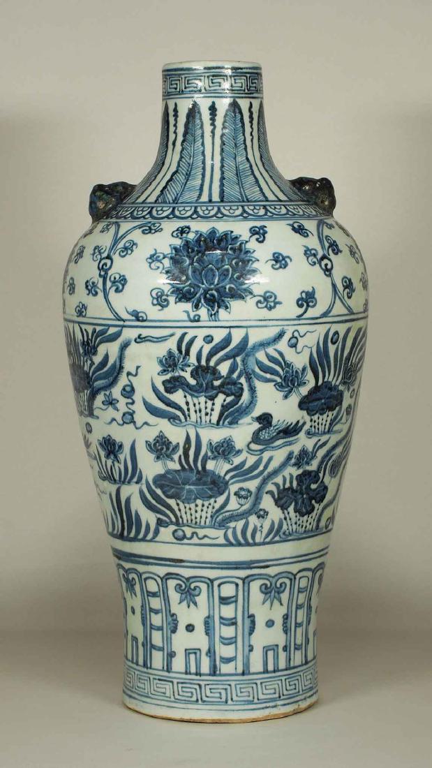 Lion-Head Handled Vase with Mandarin Ducks, early Ming: Extremely rare and highly beautiful large underglaze blue bottle vase with Mandarin ducks on a pond design. A collector item. Height 440mm, 17-1/3"inch. 15th century.