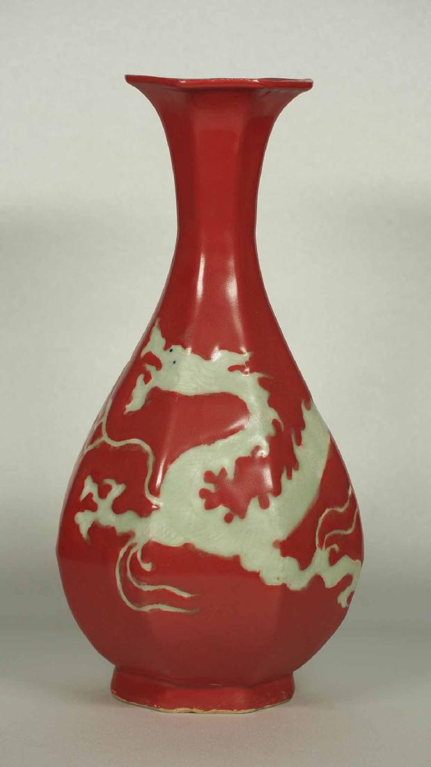 Octagonal Red Yuhuchun with Dragon, early Ming Dynasty: Extremely rare and highly beautiful red glaze yuhuchun vase with incised reverse white dragon design. Height 225mm, 8-4/5"inch. 15th century.