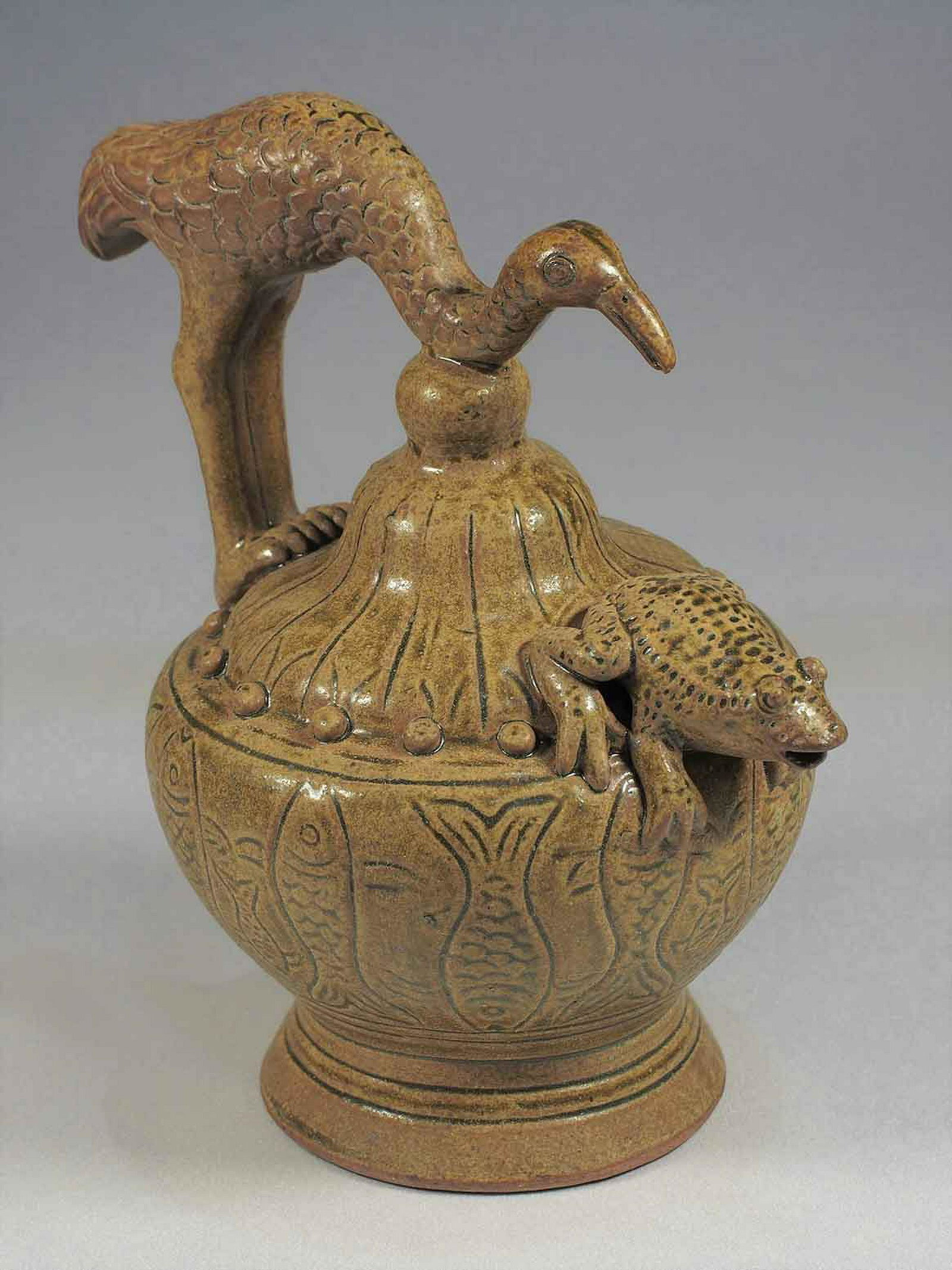 Reverse-Flow Ewer with Stork Handle, Six Dynasties: Very rare and unique brownish celadon daozhuanghu reverse-flow ewer with stork handle and toad spout design. A unique find! Height 207mm, 8-1/6"inch