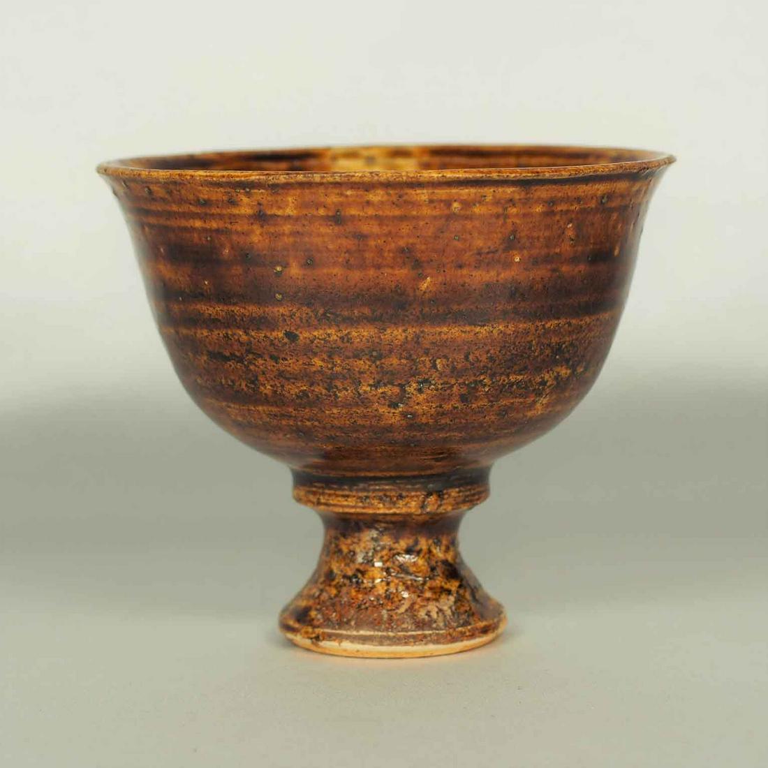 Brown Glaze Stemcup, Tang: Beautiful brown glaze stemcup. This stemcup style is popular in Tang period. Height 74mm, 3"inch