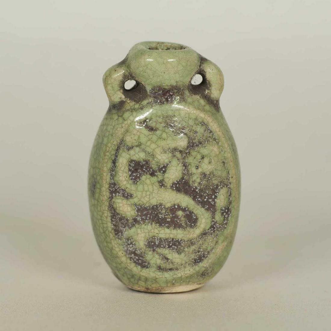 Longquan Perfume Bottle, Late Ming: Unique and rare olive green Longquan perfume bottle with carved dragon motif. Height 45mm, 1-4/5"inch